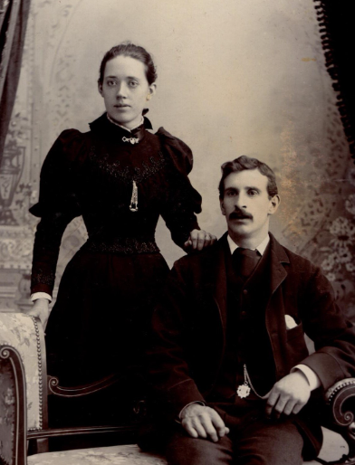 A man and a woman sitting next to each other.