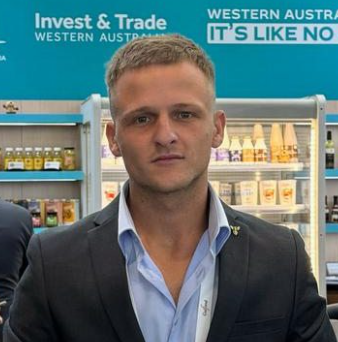 A man standing in front of a store display.