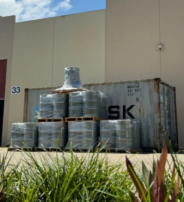 A building with a bunch of barrels in front of it.