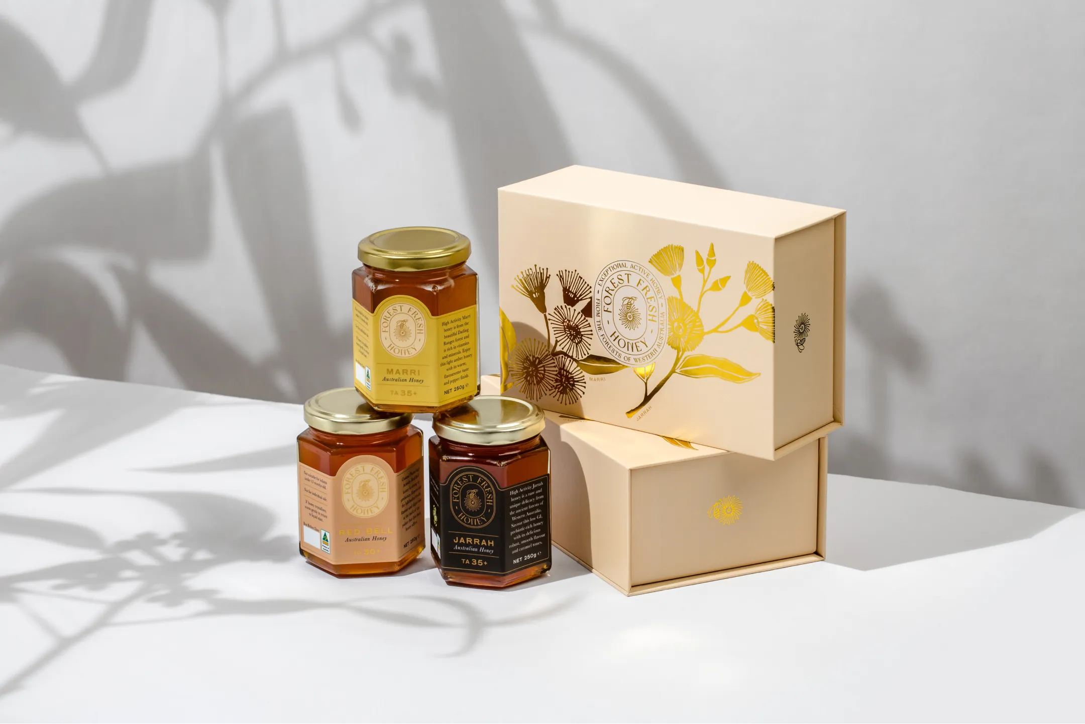 A box of honey sits next to a box of honey.